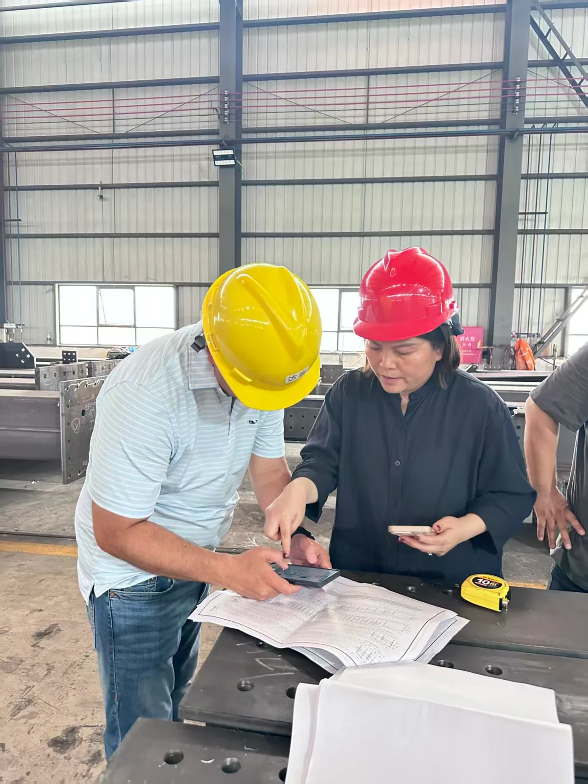 Client inspecting workshop drawings
